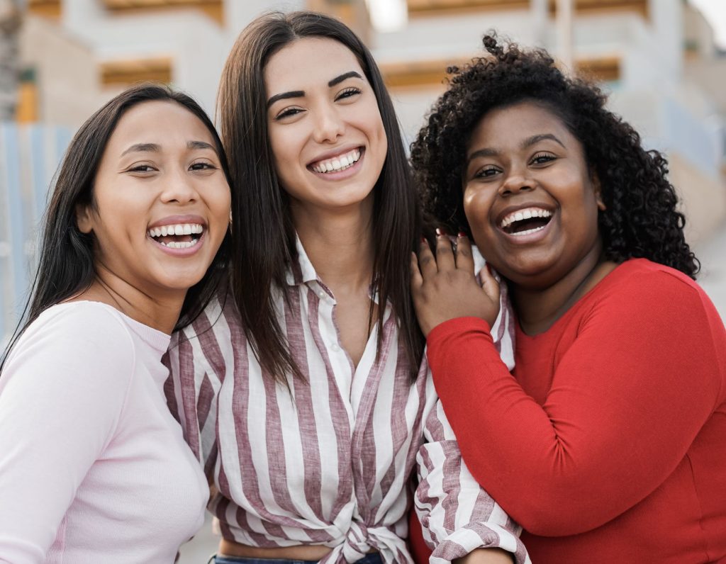 Three women smiling