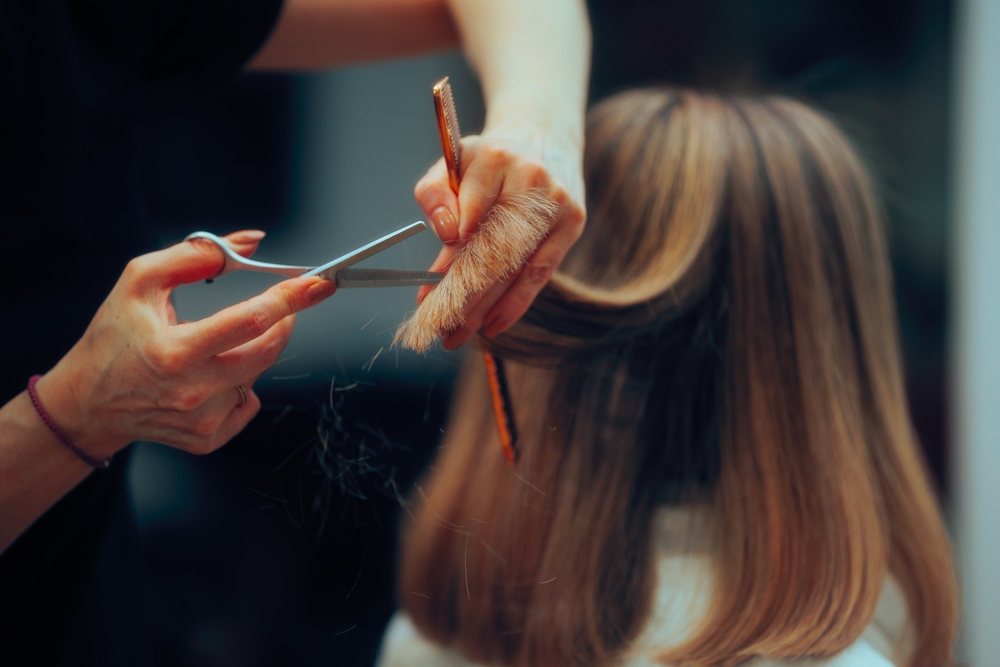 Woman having her hair cut